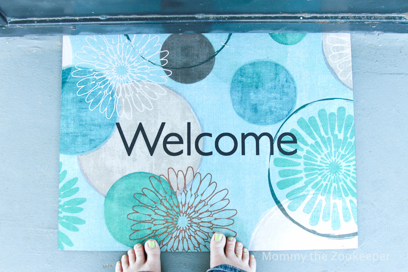 welcome mat and painted toes